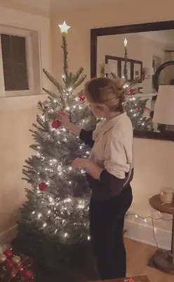 My fiancée, Dani, decorating the first Christmas tree we have had as our own after being together for ~9 years.