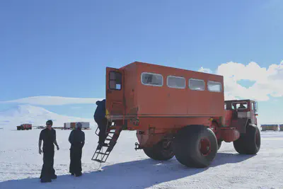 Shuttle to our plane on the McMurdo Ice Shelf with Mt. Erebus in the background.